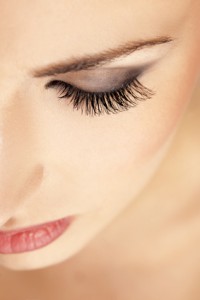 female eyebrow and eye with false eyelashes